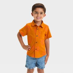 This Printed Short-Sleeve Poplin 'Button-Up' Woven Shirt from Cat & Jack™ brings fun prints to your toddler's closet. Crafted from 100% cotton poplin fabric, it offers them all-day cool comfort. It features a collared neckline with a button-up front and a chest patch pocket for classic style. Help them pair with anything from chino pants to jeans to shorts for versatile outfit options. Cat & Jack™: Designed for all children so you can trust it's made for yours. Toddler Closet, Orange Backdrop, Style Help, Outfit Options, Cotton Poplin Fabric, Face Print, Versatile Outfits, Toddler Boy Outfits, Chino Pants