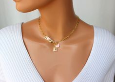 "OMG this is the cutest toggle front choker necklace ever! This lovely chain choker is made of 18k gold filled oval medium size long and short links measure 8x4mm. Toggle sits in front. The \"I Love U\" plaque, lock pendant and heart charm are all heavily 18k gold plated with crystals and pink enamel that make it stand out! I personally love this necklace! Model is wearing a 15\" length. This necklace comes in many lengths please choose your desired length. Best to measure your neck if you not s Cute Gold Choker Jewelry, Valentine's Day Gift Toggle Necklace, Gold Heart Choker, Lock Charm Necklace, 14kt Gold Jewelry, Necklace Model, Clean Sterling Silver, Lock Pendant, Gold Chain Choker