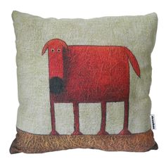 a pillow with a red dog on it