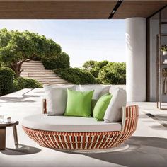 a living room filled with furniture and green pillows