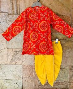 Bandhej/ Bandhani Print design cotton Kurta and Yellow Dhoti set will surely add charm to your cute Boy. Specifications Brand name - Ethnic Pehnava Type -Angrakha Kurta With Dhoti Fabric - Soft Rayon Cotton (Kids friendly fabric) Sleeves - Full Sleeves Neck - Round Neck Waistband - Elastic Occasion - Ethnic Wear / Wedding party/ Traditional wear Fit - Regular Fit Wash Care Instructions HAND WASH /GENTLE WASH ONLY. Items Included in Package 1 Kurta , 1 Dhoti Bandhani Dress Pattern, Kurta For Kids, Ethnic Wear For Boys, Kids Indian Wear, Boys Kurta Design, Bandhani Print, Bandhani Dress, Boys Kurta, Indian Dress