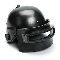 a black helmet is sitting on top of a white surface with metal rivets