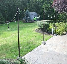 an outdoor patio and garden area with stone pavers