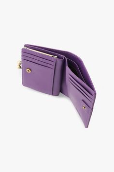 Please note that this item is final sale and cannot be returned or exchanged. See more in our Shipping and Returns page. PRODUCT DETAILS Retro style leather bifold wallet with vintage inspired flower buttons and clasp closure Purple Composition: Cow Leather Dimensions: 11'W x 9.5'H CM Exterior: 2 Decorative buttons, embossed Anna Sui logo Interior: 6 card slots, 2 bill slots, 1 divided compartment with clasp closure, button closure, Anna Sui printed lining Made with love in Vietnam Style #317452 Mesh Swimwear, Purple Retro, Vintage Closet, Vanity Accessories, New Cosmetics, Leather Bifold Wallet, Beauty Gift Sets, Decorative Buttons, Anna Sui