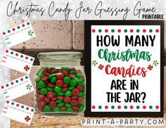 a jar filled with candy sitting on top of a table next to a sign that says, how many christmas candies are in the jar?