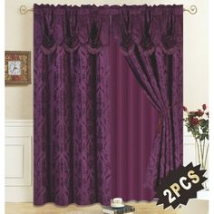 the curtains are purple and have black trimmings on them, along with a pair of