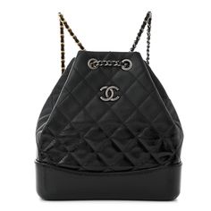 This is an authentic CHANEL Patent Goatskin Quilted Small Gabrielle Backpack in Black. This chic backpack is crafted of diamond stitched patent goatskin leather. The shoulder bag features a shiny black patent leather base, gold and silver ruthenium chain threaded black leather shoulder straps and an open top. The top opens to a spacious black fabric interior with a patch pocket. Chic Backpack, Diamond Stitch, Open Top, Black Backpack, Black Patent Leather, Black Fabric, Gold And Silver, Shoulder Straps, Patch Pocket