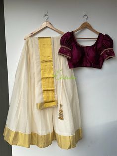 This set consist of 3 pieces- skirt, blouse and dhavani. Fabric and Work: Skirt and blouse: The skirt is made of ivory color half fine Kerala handloom with gold boarder. The blouse is made of soft pure silk fabric. The skirt and blouse is lined with a soft cotton fabric. The blouse hook opening at the back side. The handwork with puff sleeve gives it a traditional Kerala look. Dhavani: The gold Kasavu boarder of dhavani enhance the beauty of the outfit. If you have any other customization please Puff Sleeve Crop Top And Skirt Indian, Traditional Unstitched Blouse With Long Skirt Set, Cotton Lehenga With Self Design In Traditional Drape, Traditional Silk Skirt For Navratri, Navratri Traditional Drape Skirt With Unstitched Blouse, Traditional Drape Skirt With Unstitched Blouse For Navratri, Traditional Silk Skirt With Traditional Drape, Unstitched Blouse With Long Skirt For Navratri, Traditional Long Skirt With Unstitched Blouse For Navratri