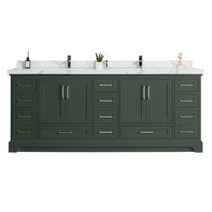 a bathroom vanity with two sinks and green cabinets