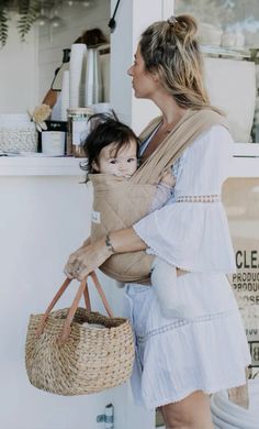 a woman holding a child in her arms