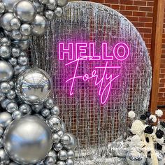 there is a neon sign that says hello to you