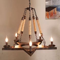 a wooden chandelier with five candles hanging from it's center and four lights on each side