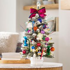 a decorated christmas tree sitting on top of a table