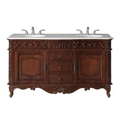 a double sink vanity with two mirrors on it's sides and an ornate carved wood frame