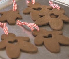 gingerbread cutouts are arranged on a baking sheet