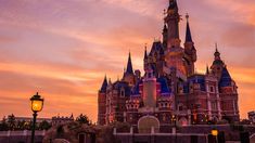 the castle is lit up at night with its lights on