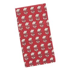 a red napkin with white flowers on it