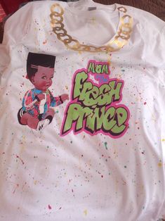 Digital  file download of Fresh Prince of Bel-Air inspired fonts for T shirt design for Family Includes 6 titles: Mom, Dad, Grandpops, Grandma, Sis and Bro of the Fresh Prince.  These can be edited to read any variation of the included title as desired for no cost. Ex: mom, mother, mama  How to create the splatter background https://youtu.be/usNZrkwOzWE Shirt is an example of font in use.  Work done by #TripleHDesign on fb for more ideas I can create any relation/kin you want it to say for an additional fee          Just inbox me what you want it to say.          The fee only includes 1 additional edit.  ALLOW 24 TO 48 HOURS FOR CHANGES DUE TO THIS BEING A PRESET FILE. ANY CHANGES HAVE TO BE CREATED AS A NEW FILE.  Digital file of Chain is also available for purchase and download Fresh Prince Baby Shower Theme Boy, Baby Shower Shirts For Family Design, Fresh Prince Baby Shower Theme, Fresh Prince Birthday Party, Fresh Prince Baby Shower, Fresh Prince Theme, Sis And Bro, 3rd Birthday Party For Boy, Prince Baby Shower Theme