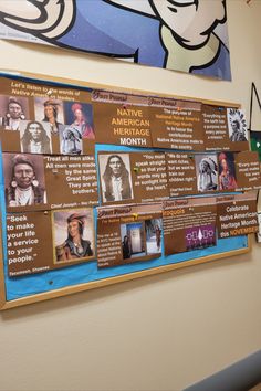 a bulletin board with native americans on it in front of a cartoon character wall mural