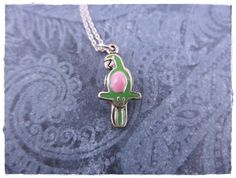 "925 Sterling Silver Green Enameled 3D Parrot charm measures 22x10.5mm and is reversible.  The enamel is on one side and may vary slightly from that shown in the photo. Chain lengths range from 14 to 30 inches (even lengths). The length shown in the photo is 18 inches. More Chain Styles:  http://etsy.me/2nUVyqL It comes beautifully gift wrapped; perfect for gift giving! Want just the charm? Choose \"Charm Only\" from the drop down box to checkout. More Bird Jewelry:  http://etsy.me/22geoqm If you have any questions, please contact me before you checkout. Placing an order means you've read and agree to my shop policies. Check out the rest of my shop for more: www.etsy.com/shop/EvelynMaeCreations My Website: http://bit.ly/evelynmaecreations" Silver Enamel Pendant Charm Necklaces, Nickel-free Enamel Pendant Charm Necklace, Silver Enamel Charm Necklace For Gift, Parrot Necklace, Photo Chain, Green Parrot, Bird Jewelry, Pink Enamel, Green Enamel