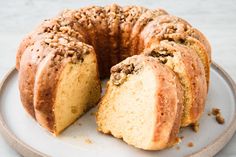 a bundt cake on a plate with one slice cut out