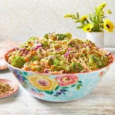 a colorful bowl filled with broccoli slaw