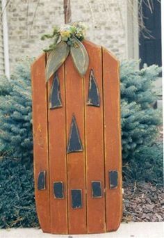 an old wooden door with decorations on it