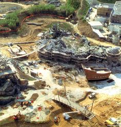 an aerial view of a construction site with boats