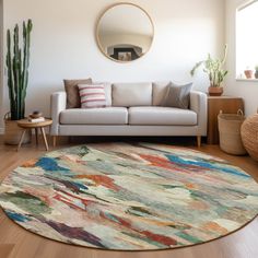 a living room with a white couch and colorful rug