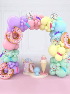 a balloon arch with doughnuts, balloons and ice cream