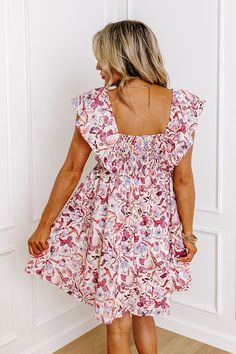 - You will look enchanting in this darling dress! - Lightweight material with a pink and purple hued floral print and a built-in lining - A v-cut neckline with gathered detail - Short flutter sleeves with an interior non-slip strip - A stretchy smocked back with zip closure - Hidden side pockets - A figure flattering silhouette that ends in a straight mini dress length hemline Measurements S : Bust 32", Hip 44", Length 28.5", Sleeve Length 5.5", Waist 28". M : Bust 34", Hip 46", Length 28.5", Sl Pink Floral Print Dress With Ruffle Sleeves, Pink Ruffle Sleeve Dress With Floral Print, Pink Butterfly Sleeve Dress For Brunch, Pink Floral Dress With Smocked Back, Pink Floral Dress With Flutter Sleeves And Ruffles, Feminine Floral Dress With Flutter Sleeves For Brunch, Pink Ruched Dress With Ruffle Sleeves, Pink Floral Print Dress With Butterfly Sleeves, Pink Floral Print Dresses With Butterfly Sleeves