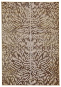 an animal print rug with brown and white stripes