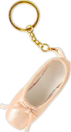 a pair of ballet shoes keychain on a white background