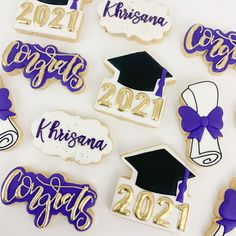 decorated cookies with graduation caps and mortars on them are arranged in the shape of numbers