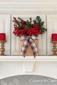 White cabinets with basket of Christmas greens and berries with plaid bow