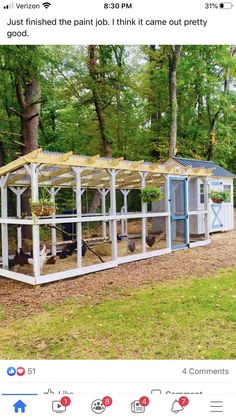 a chicken coop in the middle of a field with trees and grass behind it, on instagram