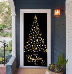 a christmas tree decorated with gold stars and baubles on a black background door cover