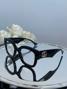 Brand new Gucci GG1423O 001 Frames. Color: Black. Shape: Square. Lens Width: 50mm. Lens Bridge: 23mm. Arm Length: 145mm. Made in: Italy. Retail Price: $465. Lens: Demo plastic lens, can be worn as is or swapped to your personalized ones! Arrives in Gucci jewel-toned velvet case with matching satin pouch, cleaning cloth, and authenticity card. All items are guaranteed 100% authentic and brand new. Elegant Gucci Luxury Cat Eye Sunglasses, Chic Gucci Luxury Shield Sunglasses, Chanel Glasses Frames, Gucci Glasses Eyeglasses, Gucci Eyeglasses Women, Bold Glasses, Glasses Inspo, Gucci Eyeglasses, Satin Pouch