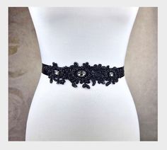 A really great belt for wedding dress in black color, decorated with lace, crystal beads, rhinestones and sequins. The motif is 21 cm. long and 5 cm. broad . Total length 2.5 meters. Fitted Rhinestone Belts For Party, Fitted Rhinestone Sashes For Party, Party Fitted Sashes With Rhinestones, Embellished Fitted Sash For Party, Elegant Embellished Bridal Belt For Evening, Elegant Embellished Sashes For Party, Embellished Party Sash, Elegant Fitted Lace Bridal Belt, Elegant Lace Fitted Bridal Belt