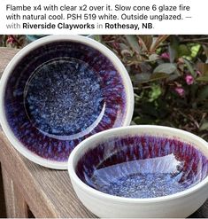 two bowls sitting on top of a wooden table next to each other with blue and purple designs