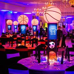 an indoor basketball themed event with tables and chairs