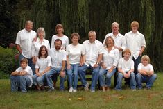 a group of people sitting on top of a wooden bench