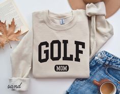 a sweater with the word golf mom on it