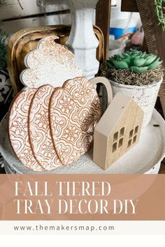 fall themed tray decor with pumpkins, succulents and other things on it