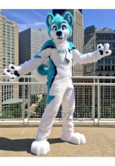 an animal mascot standing in front of a cityscape with his arms out and legs spread