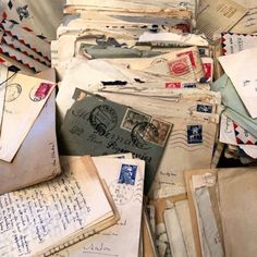 a pile of old mail sitting on top of each other