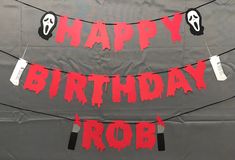 happy birthday rob banner with two faces on it and the words happy birthday rob written in red