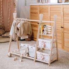 a wooden rack with baskets and clothes on it