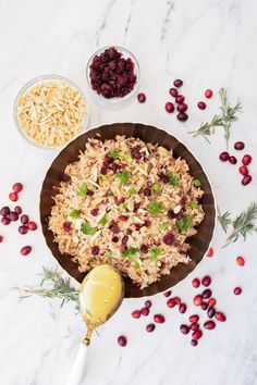 rice with cranberries and other ingredients on a table