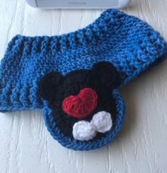 there is a crocheted hat with a mickey mouse on it